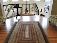 brown-wood-floors-rug-chairs